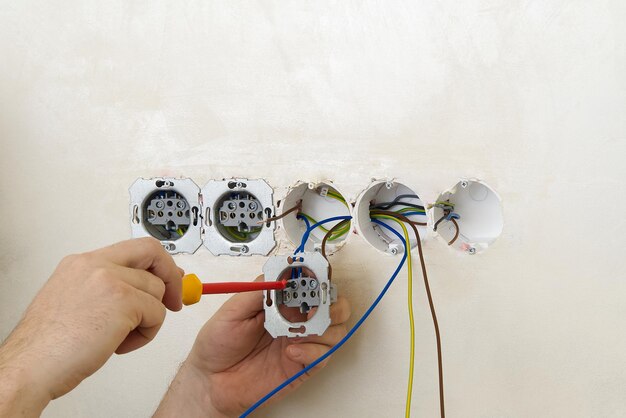 close-up-man-repairing-electric-equipment-home_1048944-2935960