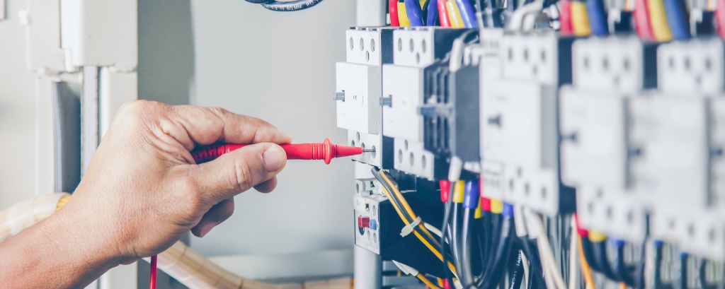 electrical-engineer-checking-operation-electrical-control-cabinet-maintenance-concept
